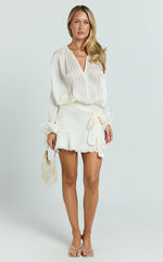 Carmela Mini Dress - Long Sleeve Tie Neck Ruffle Skirt Dress in Off White